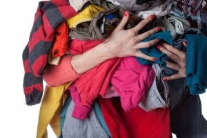 Photo of a woman holding clothing